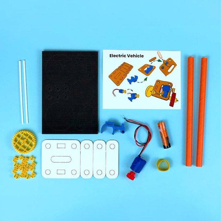 Everything inside an Electric Vehicle Spark: parts, wires, battery holder and an illustrated guide
